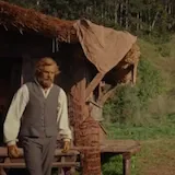 A greeting in a rural field brings hungry villagers and a line about at 0:01