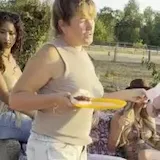 Women in western outfits hanging out on patio at 0:11